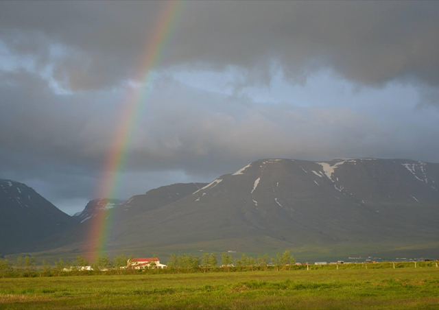 Midnight rainbow in Iceland: enjoying a rainbow at midnight while road tripping around Iceland